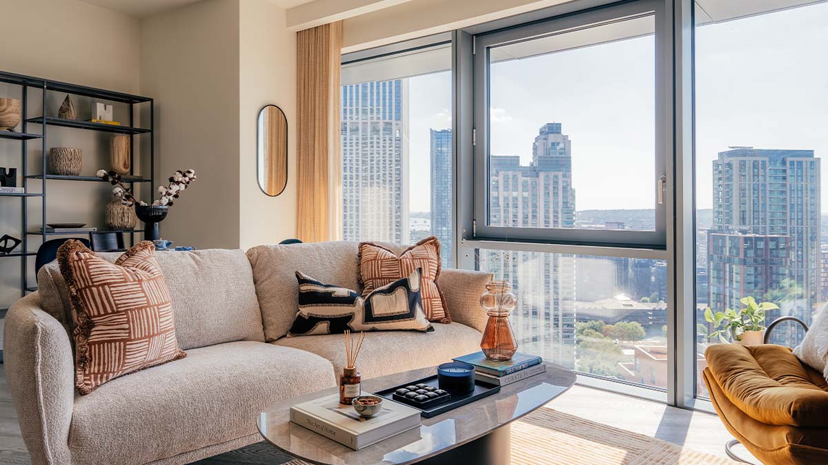 Modern living room with city view and comfortable sofa